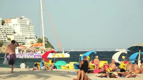 Catamaran on Mediterranean beach Video stock 12518520
