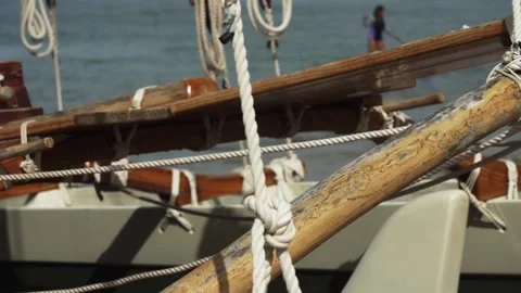 Catamaran Polynesian double-hulled ship deck rigging with winch and ropes Stock Footage 148041247