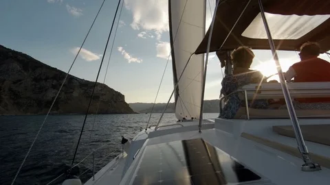 Catamaran Sailboat, view of the deck and the sails during navigation at sunset. Stock Footage 95834629