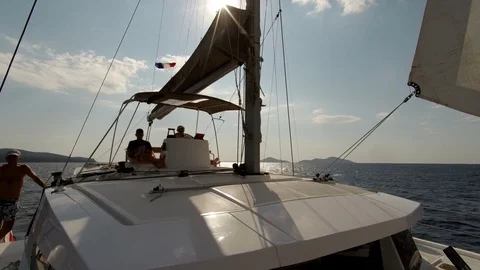 Catamaran Sailboat, view of the deck side and the sails during navigation Stock Footage 95834355
