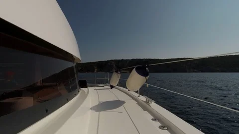 Catamaran Sailboat, view of the deck side during navigation at sunset Stock Footage 95835151