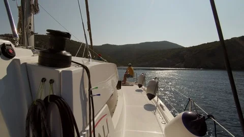 Catamaran Sailboat, view of the deck side during navigation at sunset Stock Footage 95835168