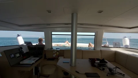 Catamaran Sailboat, view from the main window, people relaxing during navigation Stock Footage 95833513