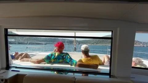 Catamaran Sailboat, view from the main window, people relaxing Stock Footage 95835502