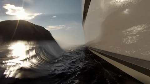 Catamaran Sailboat view by the side of the hull in navigation with waves Stock Footage 95896044