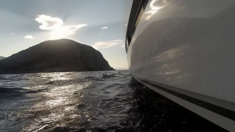 Catamaran Sailboat view by the side of the hull in navigation with waves Stock Footage 95898059