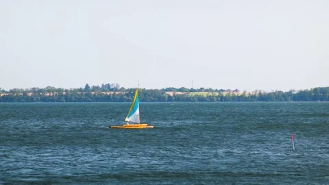 Catamaran sailing on a large lake Stock Footage 208864876