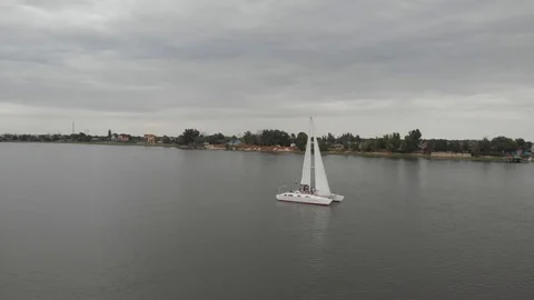 Catamaran sailing on the river Stock Footage 93556775