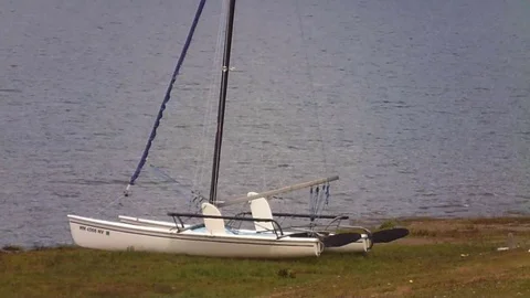 CatamaranonBeachNexttoLazyRiver Stock Footage 105880384