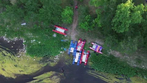 Catamarans moored on the camp after fun alloy on the fast wild river Stock Footage 246581276