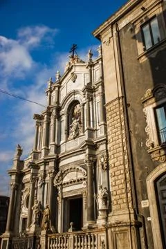 Catania cathedral side view with close baroque architecture building Stock Photos