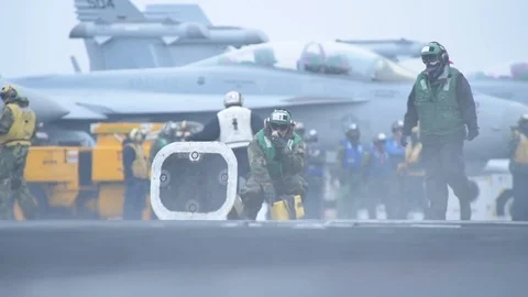 Catapult crew walking on flight deck aboard USS Theodore Roosevelt Stock-Footage 108535322