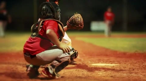 Catcher during baseball game with batter at home plate Stock Footage 52865708