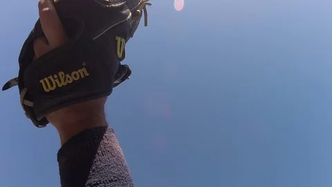 Catching basebal with black glove in slow motion Stock Footage 80357845