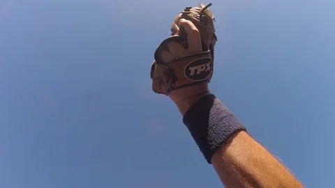 Catching baseball and dust flying in slow motion Stock Footage 80357902