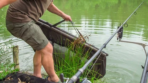 Catching a fish and pulling it out of the water Stock Footage 112184756