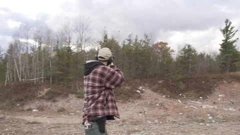 Catching shell ejected from shotgun Stock Footage 100137861