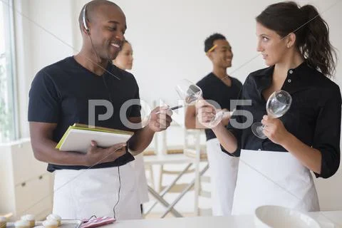 Caterers Working Together In Event Space