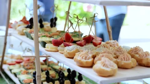 Catering on a banquet table with appetizers-canapes in a restaurant or hotel Stock Footage 253323400