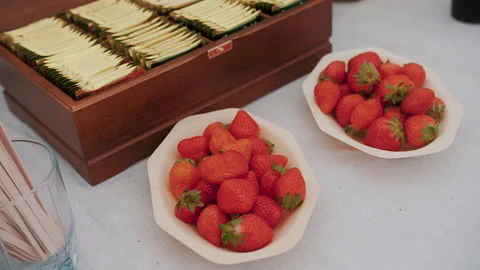 Catering buffet.. Close-up of a tea table with wooden sticks Stock Footage 157370416