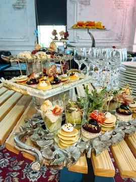 Catering Buffet Table with Appetizers and Desserts Stock Photos