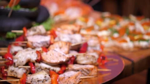 Catering Buffet Table with Grilled Meat Skewers and Appetizers Close Up Vidéo 336808806