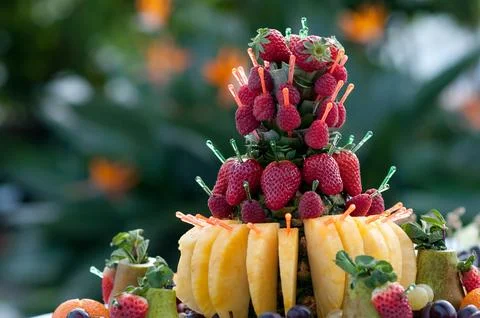 Catering buffet table with snacks and appetizers.Dessert with fresh fruit on Stock Photos
