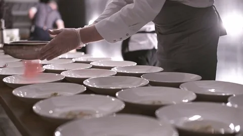 Catering company preparing large numbers of food Stock Footage 71502345