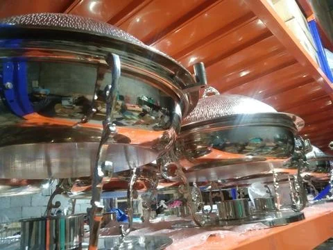 The catering dishes in the rack Stock Photos