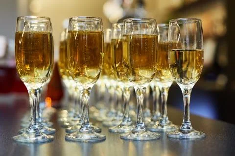 Catering event. A buffet table with chilled champagne and a lot of glasses Stock Photos