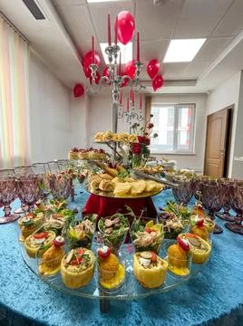 Catering at the event snacks and salads and a festive table Stock Photos