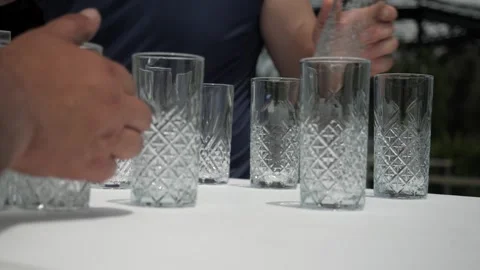 Catering men are preparing glasses for the event Stock Footage 265680711
