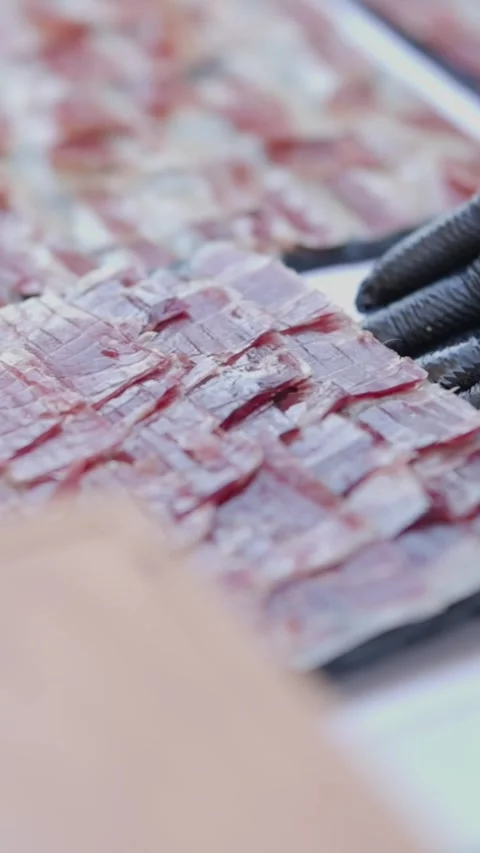 Catering service preparing delicious iberian ham appetizer platters Stock Footage 327805989