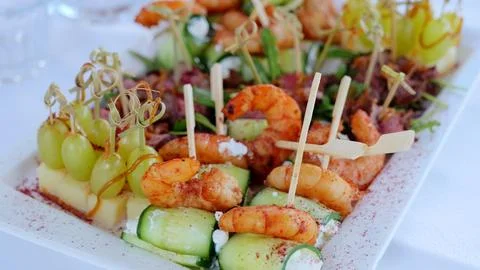 Catering service presenting an enticing array of appetizers, including grilled Foto stock