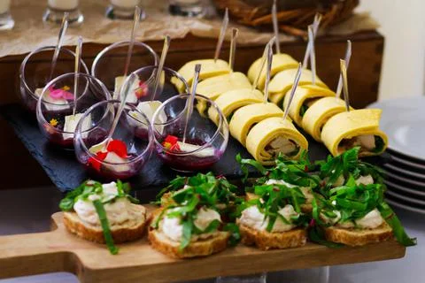 Catering service. Snacks for guests on the table. Stock Photos