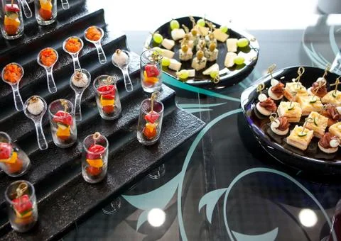 Catering services background with snacks on guests table Stock Photos