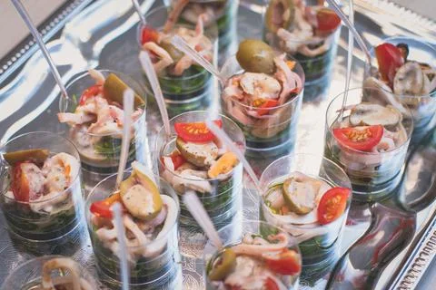 Catering table buffet dinner, beautifully decorated banquet with variety of d Stock Photos