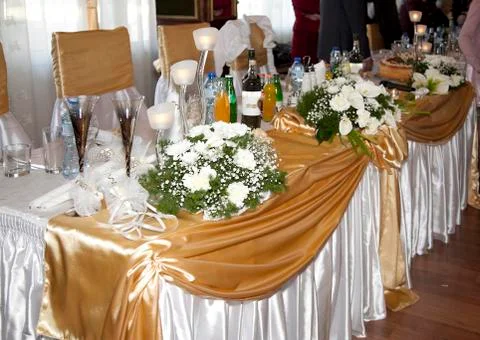 Catering table set service with silverware, fresh flowers and gl Stock Photos
