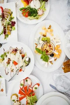 Catering table set service with silverware and glass stemware at Foto stock