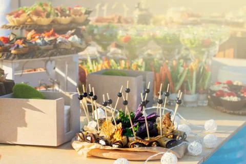 Catering table set service with silverware and glass stemware before party Stock Photos