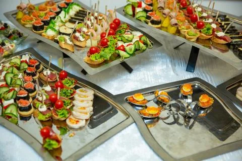 Catering table set service various snacks on a table at banquet. Set of cold  Stock Photos