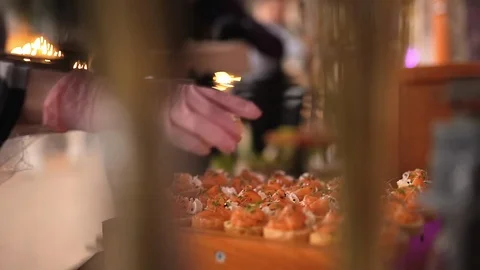 Catering, the waiter serves snacks to the table Stock Footage 124030341