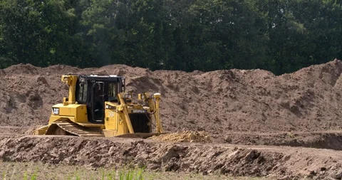 Caterpillar earth mover in action at construction site, Netherlands 4K Stock Footage 109571910