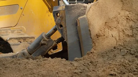 Caterpillar yellow tractor working with sand Stock Footage 278399552