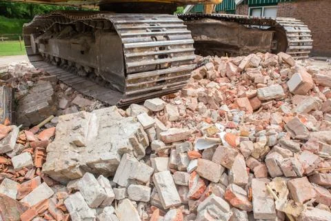 Caterpillars on heap of broken bricks Stock Photos