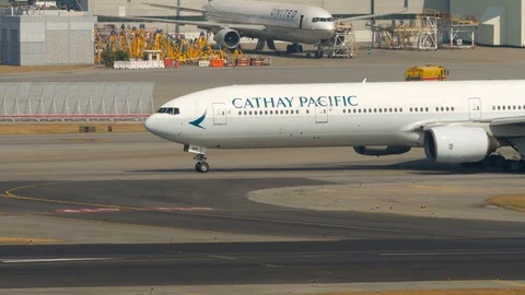 Cathay Pacific Boeing 777 turn runway Stock Footage 121804143