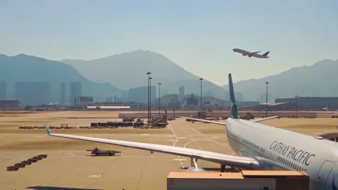 A Cathay Pacific plane is at the terminal, slow motion, Chek Lap Kok Airport Stock Footage 165252028