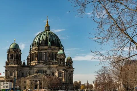 The cathedral of Berlin with a tree on the side Stock Photos