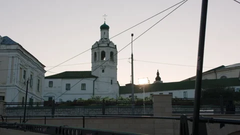 Cathedral glows under sunset illuminating tall towers Stockbeeldmateriaal 321944785