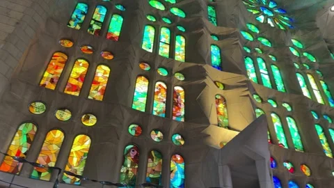 Cathedral interior displays towering stained glass panels in vivid green, g.. Stock Footage 344736949